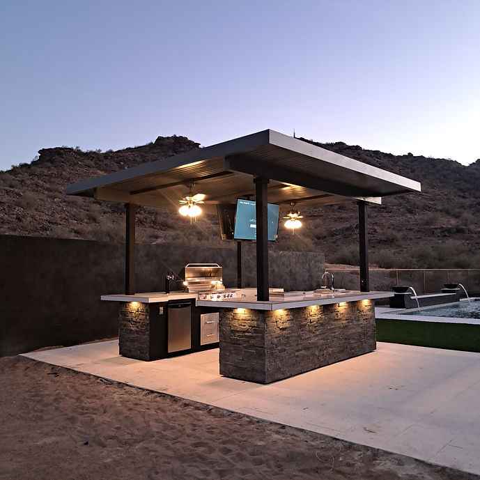 KoKoMo outdoor sports bar kitchen island with grill and TVs